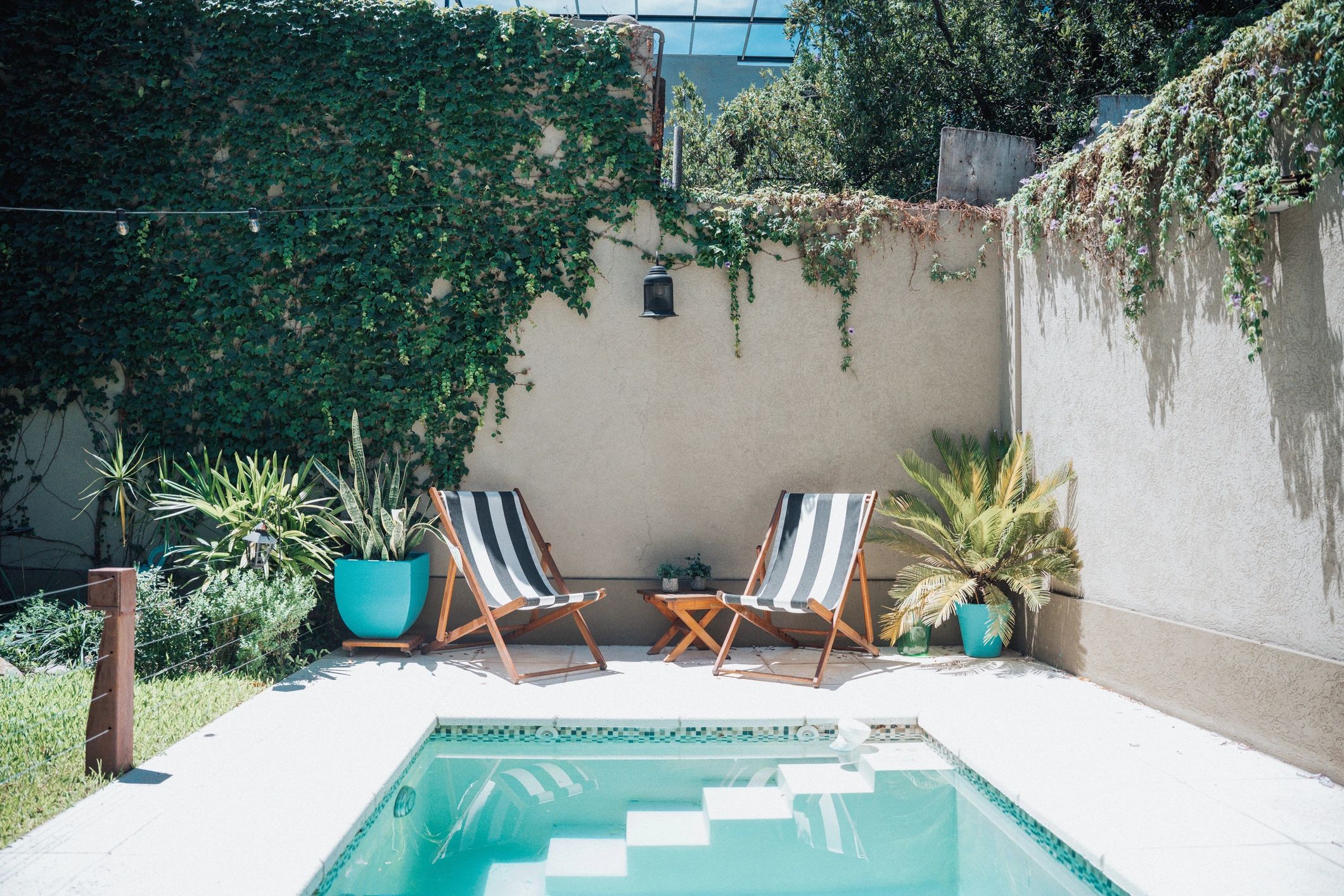 Backyard patio with fencing and outdoor seating
